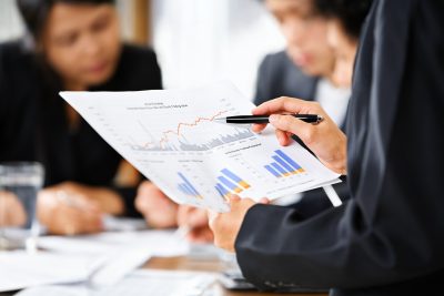 person examining graphs